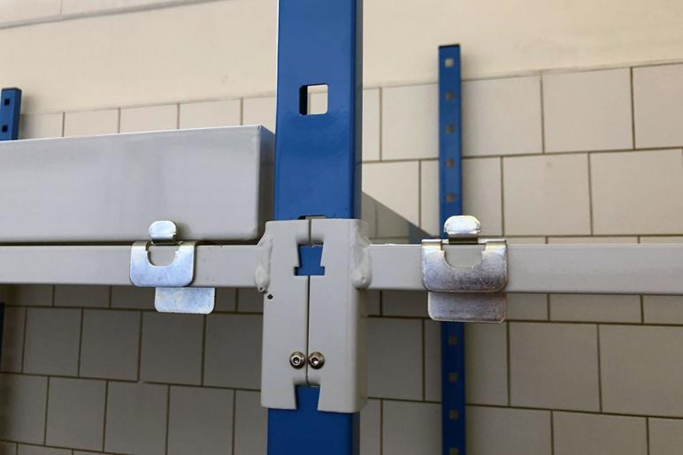 Removable spill trays with retaining clips