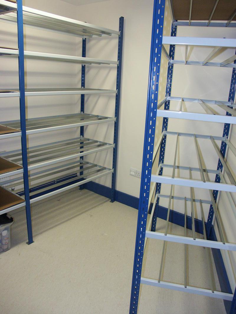 Tubular shelving on fixed racking