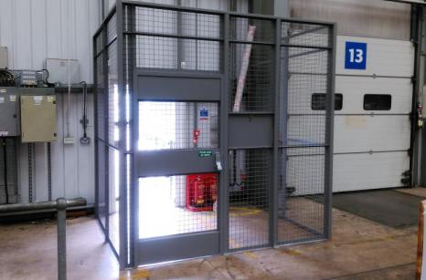 Restricted access to warehouse with drivers cage showing hatch closed