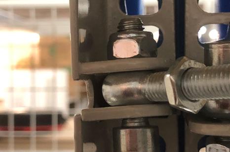 Close up of hinges on mesh doors for longspan shelving