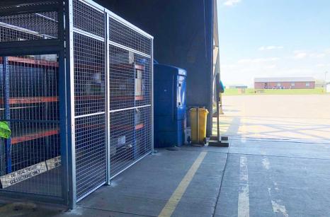 Cage located near front hanger entrance for easy access