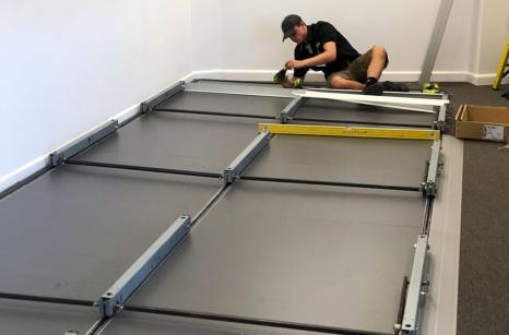Build process laying track mobile shelving