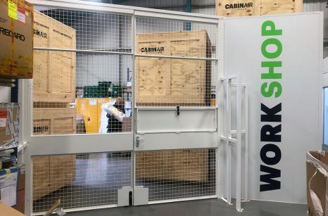 Large double door with logo to workshop